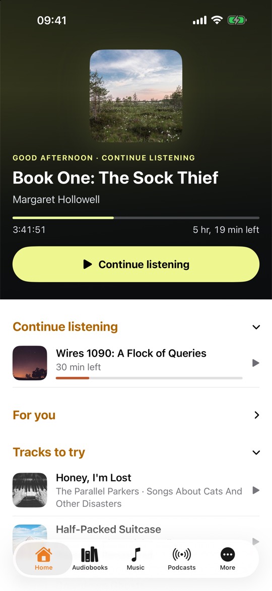 CLAUDIO home view on iPhone: an audiobook at the top with cover art, progress bar, time left and a continue listening button, followed by the sections continue listening, for you and tracks to try, with tabs for home, audiobooks, music, podcasts and more along the bottom